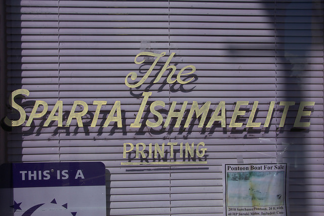 Sparta Ishmaelite Newspaper Window Sign Photograph Copyright Brian Brown Vanishing North Georgia USA 2014